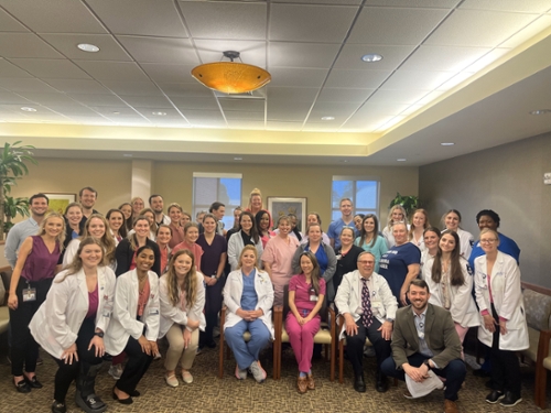 Dermatology faculty and staff and Dermatology Interst Group members pose for a photo during the annual free skin cancer screening at our Grants Ferry location.